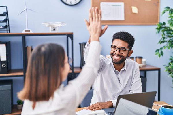 man-woman-business-workers-high-five-with-hands-raised-up-office-min man-woman-business-workers-high-five-with-hands-raised-up-office-min